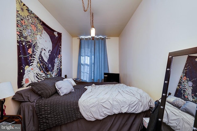 bedroom featuring an inviting chandelier