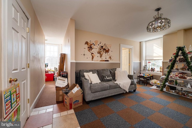 living room with tile patterned floors