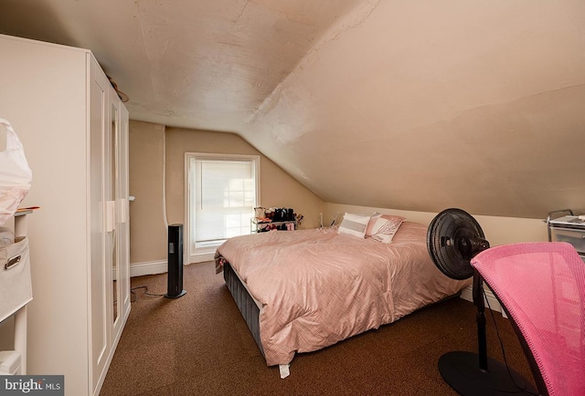 carpeted bedroom featuring vaulted ceiling