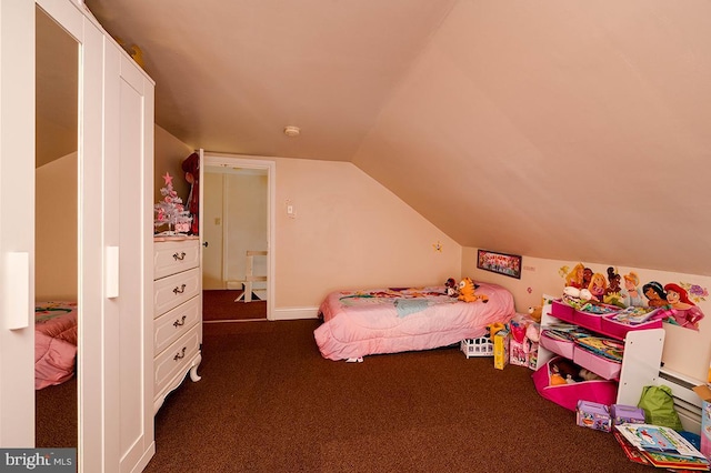 carpeted bedroom with lofted ceiling