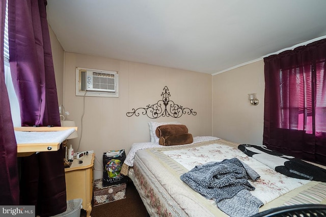 bedroom featuring a wall mounted air conditioner