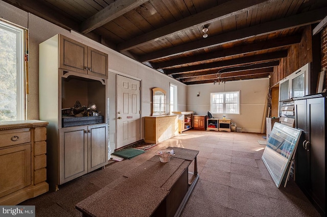 miscellaneous room with beamed ceiling and wood ceiling