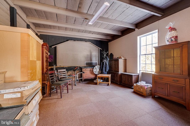 sitting room featuring beam ceiling and wooden ceiling