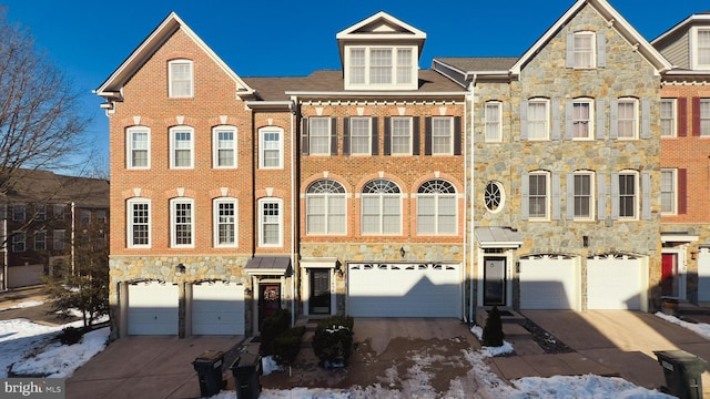 townhome / multi-family property featuring a garage