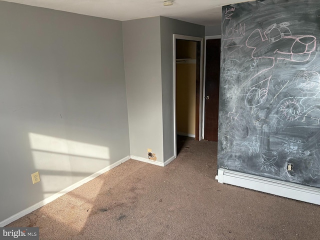 unfurnished bedroom with a baseboard radiator, a closet, and carpet