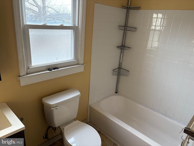 full bathroom featuring toilet, vanity, and bathtub / shower combination