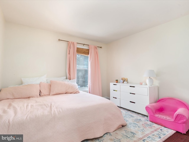 bedroom with wood-type flooring