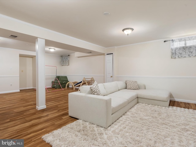 living room featuring ornamental molding and hardwood / wood-style flooring