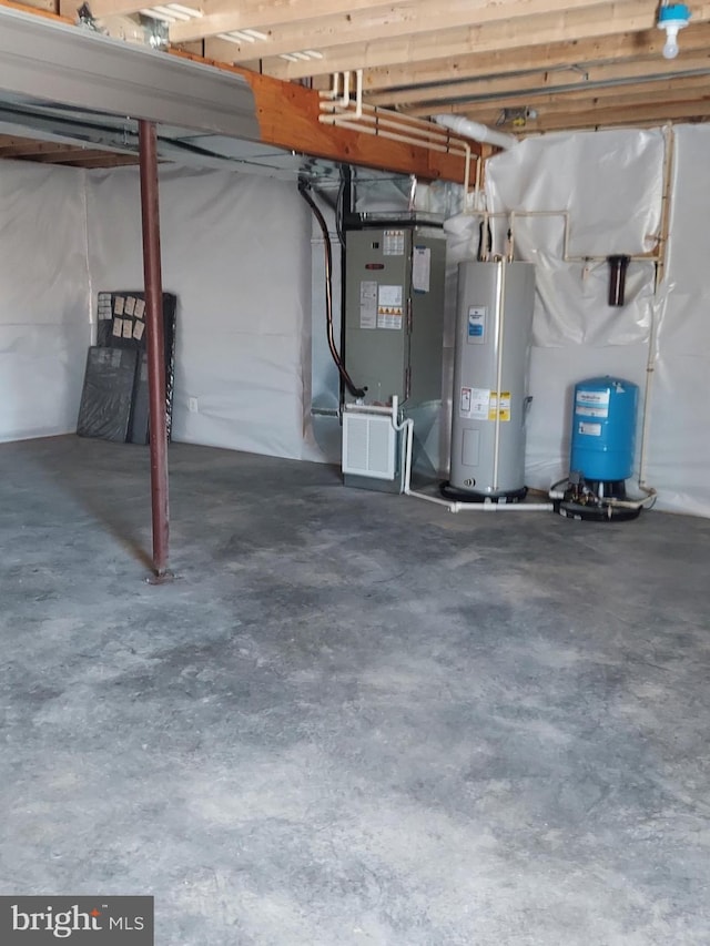 basement with electric water heater and heating unit