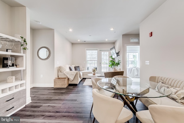 dining area featuring dark wood-type flooring