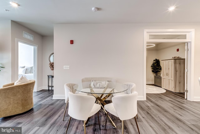 dining space featuring hardwood / wood-style floors