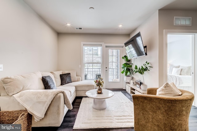 living room with dark hardwood / wood-style floors