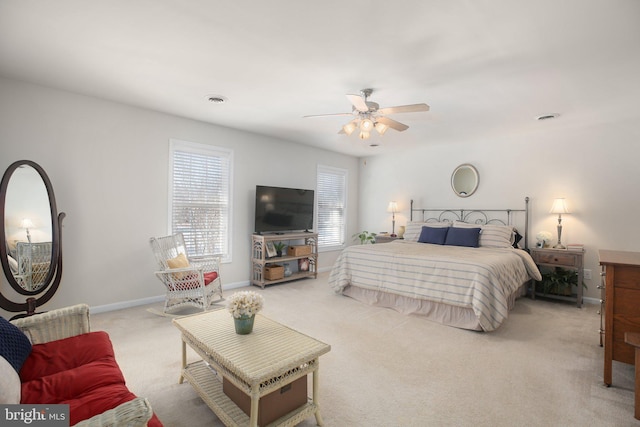 bedroom featuring ceiling fan and light carpet