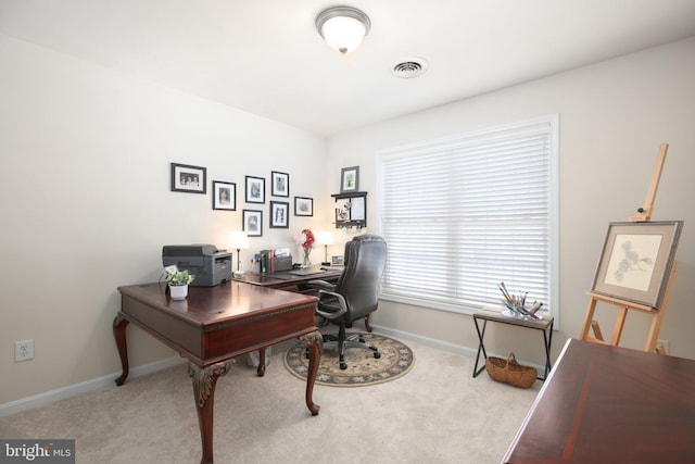 office space with light colored carpet