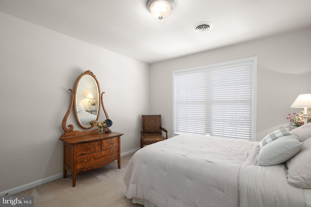 bedroom with light carpet