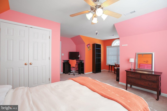 bedroom featuring light carpet, a closet, and ceiling fan