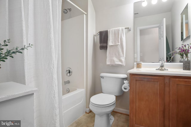 full bathroom featuring vanity, tile patterned flooring, toilet, and shower / bath combo with shower curtain