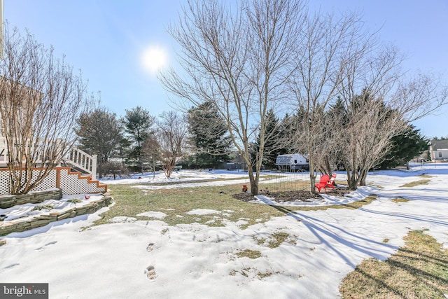 view of yard covered in snow