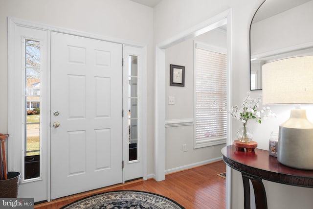 foyer entrance with light hardwood / wood-style flooring