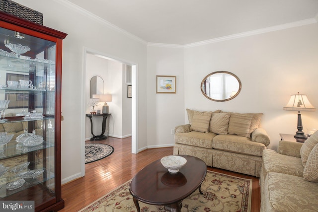 living room featuring ornamental molding and hardwood / wood-style floors