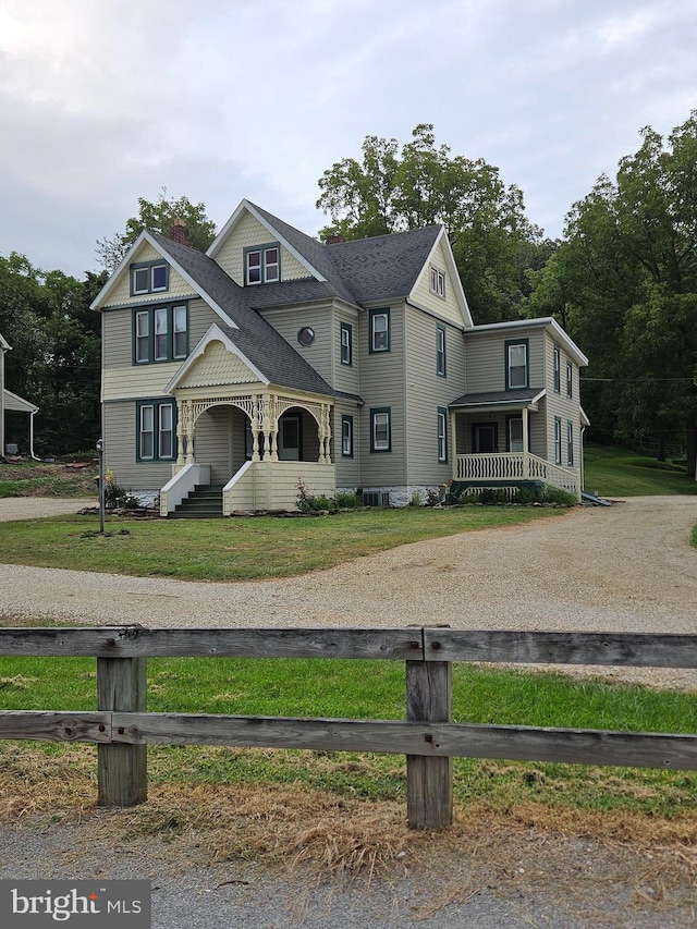 victorian house featuring a porch