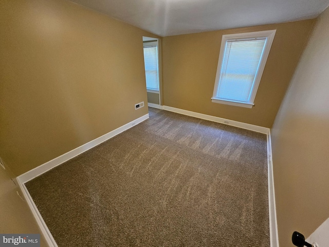 empty room featuring carpet floors