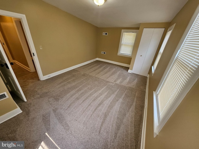 unfurnished bedroom with carpet