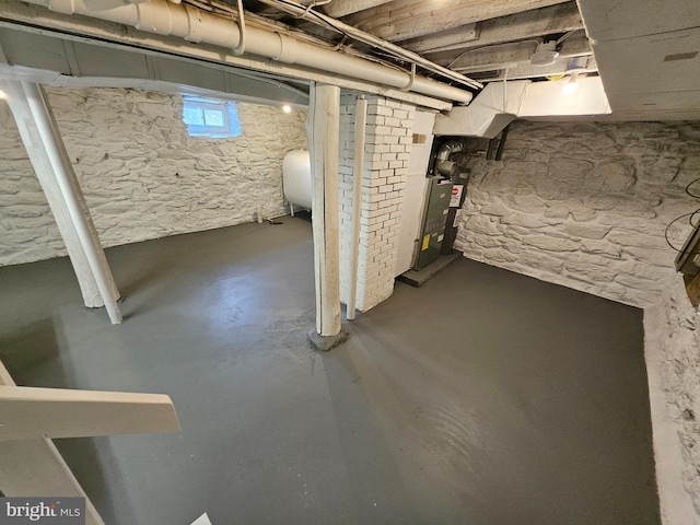 basement featuring heating unit