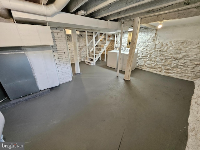 basement featuring washer and clothes dryer