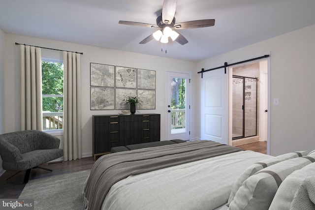 bedroom featuring ceiling fan, a barn door, dark wood-type flooring, and access to outside