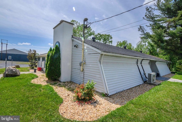 exterior space with a lawn and cooling unit