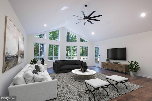 living room featuring high vaulted ceiling, wood finished floors, a ceiling fan, and baseboards