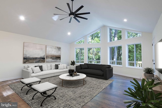 living room with high vaulted ceiling, recessed lighting, wood finished floors, and baseboards