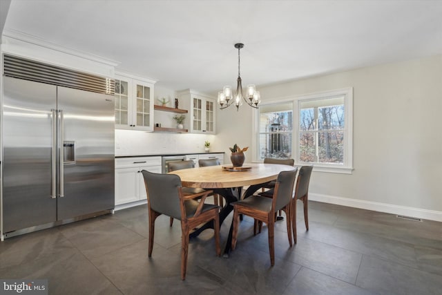 dining space with a notable chandelier