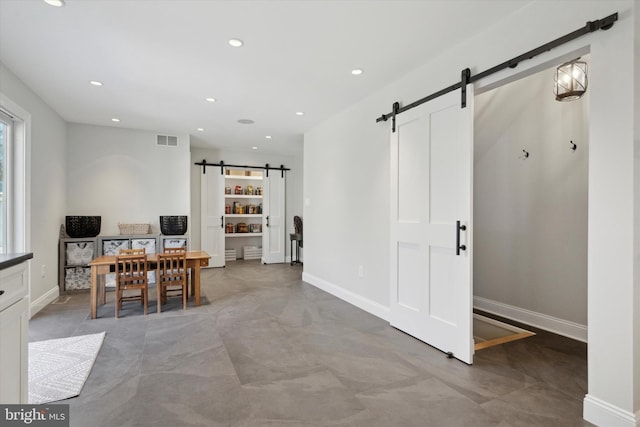 dining space with a barn door