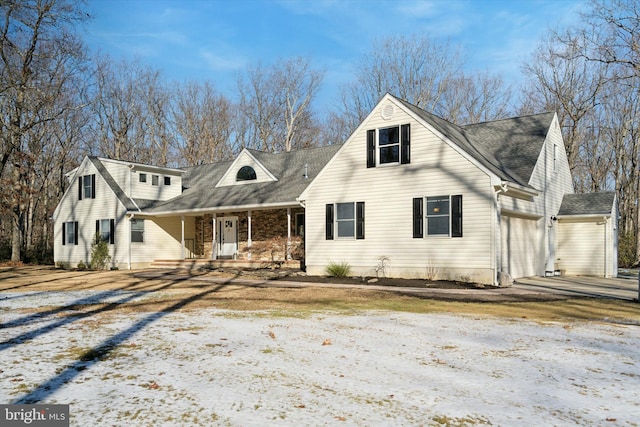 view of front of home with a garage and covered porch