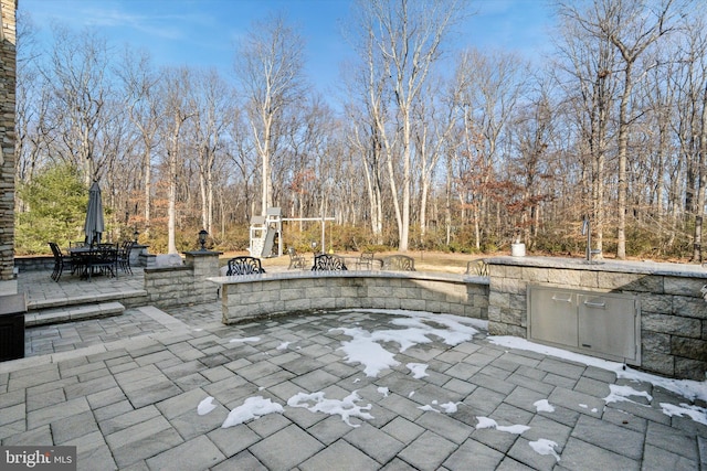 view of patio featuring exterior kitchen