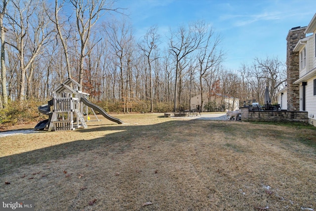 view of yard with a playground