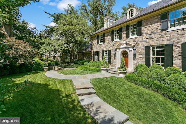 view of front of home with a front yard