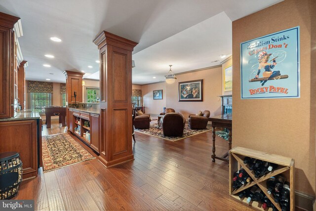 40959 Pacer Ln, Paeonian Springs, VA 20129 - interior space with dark wood-style floors, recessed lighting, brown cabinetry, ornate columns, and open floor plan