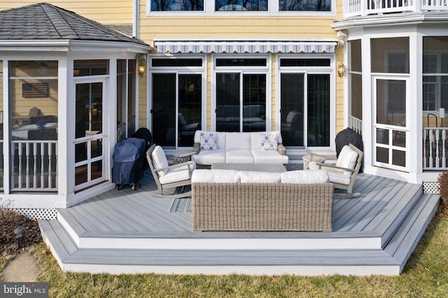 wooden terrace featuring grilling area, outdoor lounge area, and a sunroom