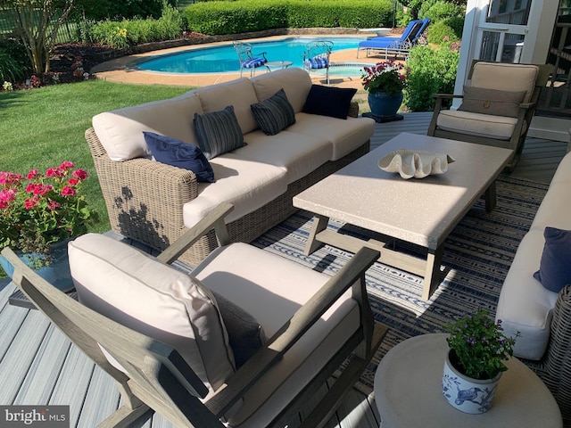 exterior space featuring an outdoor living space and a lawn