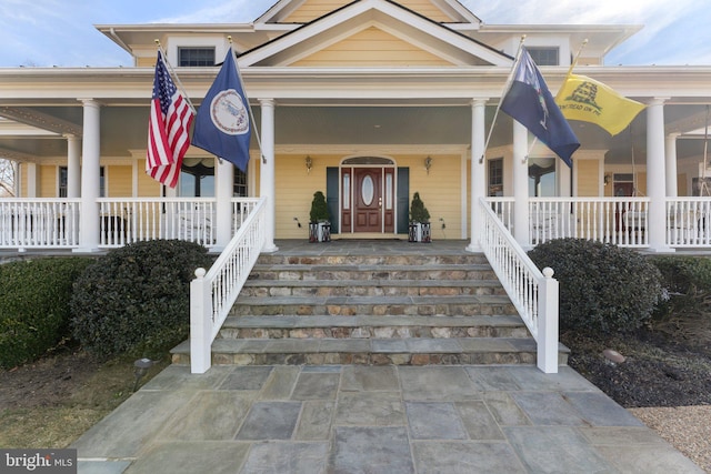 doorway to property with covered porch