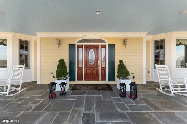 doorway to property featuring covered porch