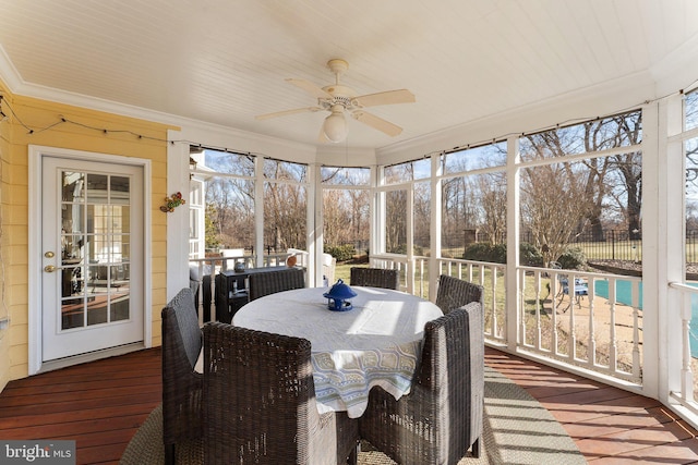 sunroom with plenty of natural light and ceiling fan