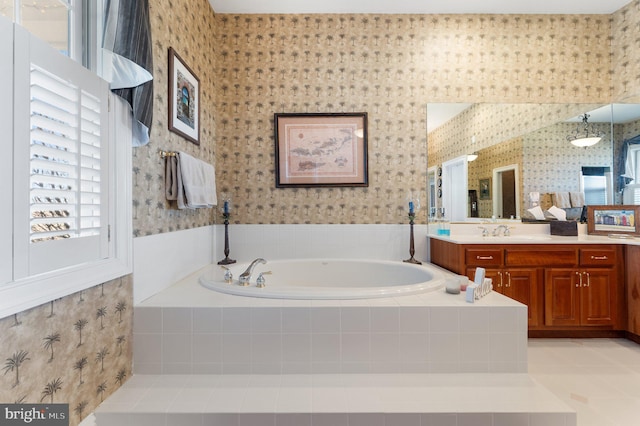 bathroom with a bath, tile patterned flooring, wallpapered walls, and vanity