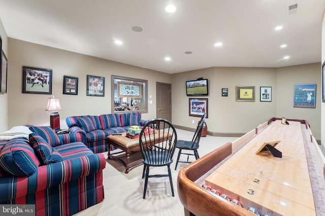 living room with recessed lighting, visible vents, light carpet, and baseboards