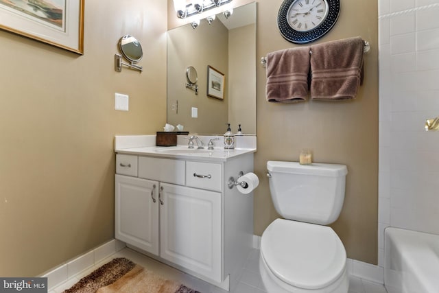 full bathroom featuring vanity, toilet, and baseboards