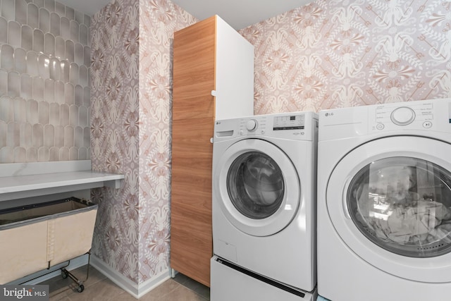 washroom featuring separate washer and dryer and tile patterned floors