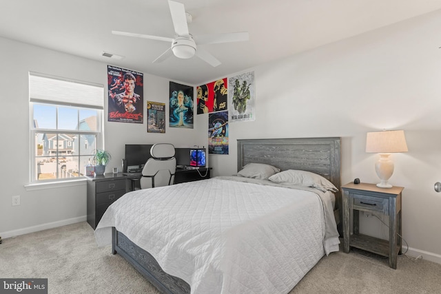 bedroom with ceiling fan and light carpet